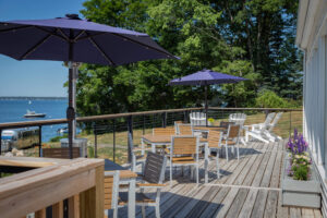 The patio of a Boothbay Harbor resort's restaurant to dine at after visiting the Maine Coastal Botanical Garden.