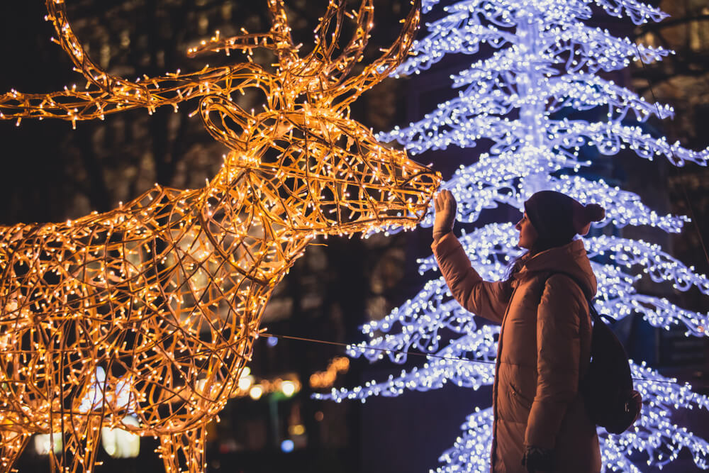 A girl looking at one of the displays at Gardens Aglow in Midcoast Maine.