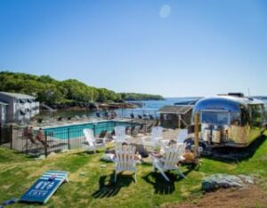 The firepit area of a coastal Maine resort to relax by after spending time exploring things to do in Damariscotta.