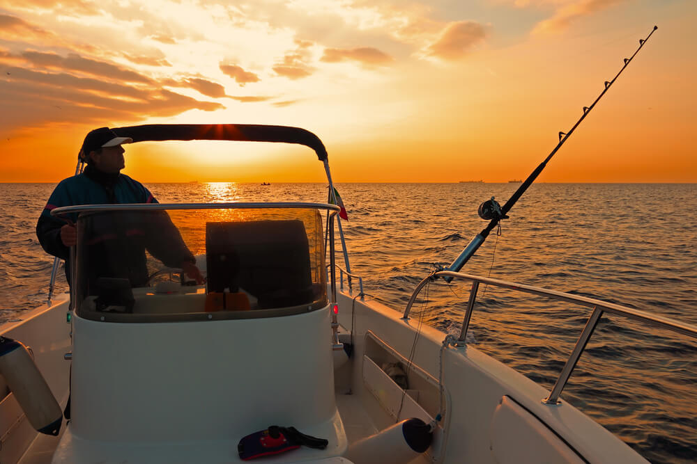 A man out fishing with a one of the best Midcoast Maine charters.