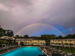 A photo of rainbow over Smuggler's Cove Inn taken by a guest inspired by the Maine nature around him.