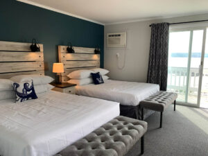 A guestroom at a Boothbay Harbor area hotel close to local shopping.
