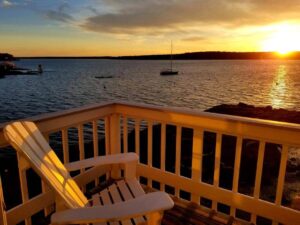 A balcony at a room at an East Boothbay hotel to stay at on romantic Maine vacations.